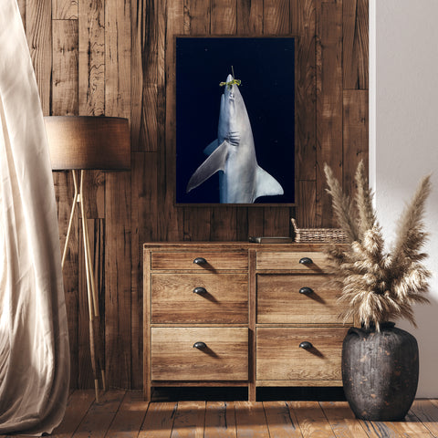 Living room view with an underwater photograph of a shark reaching for a leaf hanging on the wall 